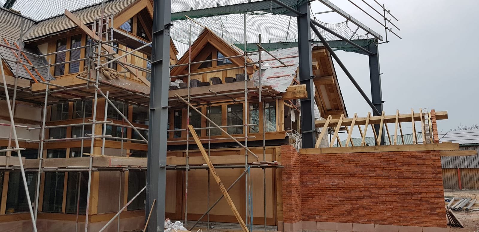 New oak frame and steel structure under construction