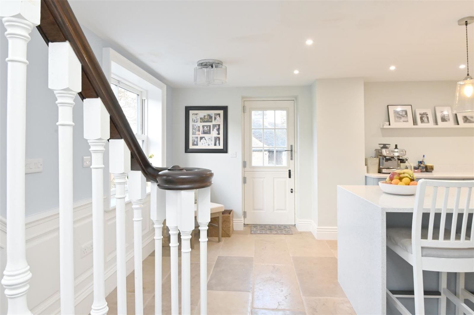 Refurbished hallway and staircase with limestone floor