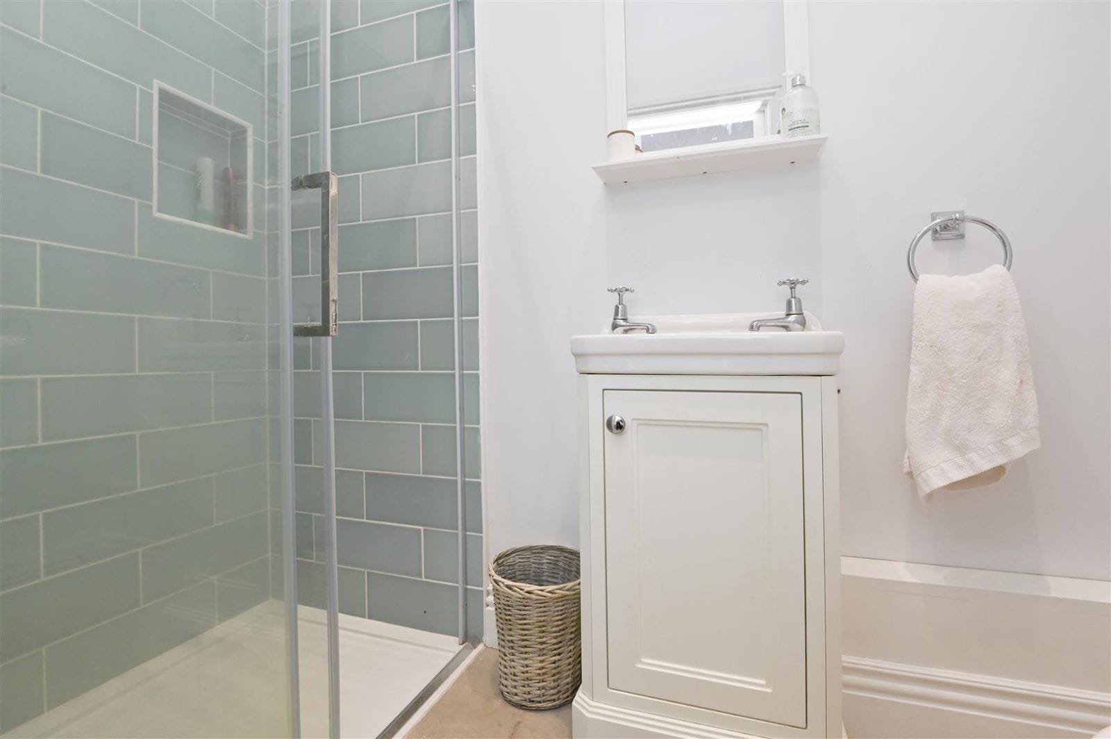Shower room with sage green metro tiles