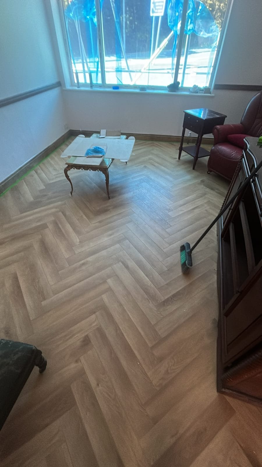 New herringbone-effect flooring in the refurbished living room