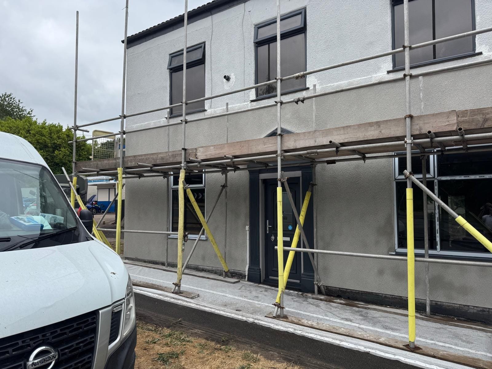 New Tyrolean render applied to the front of the former pub in Oldham