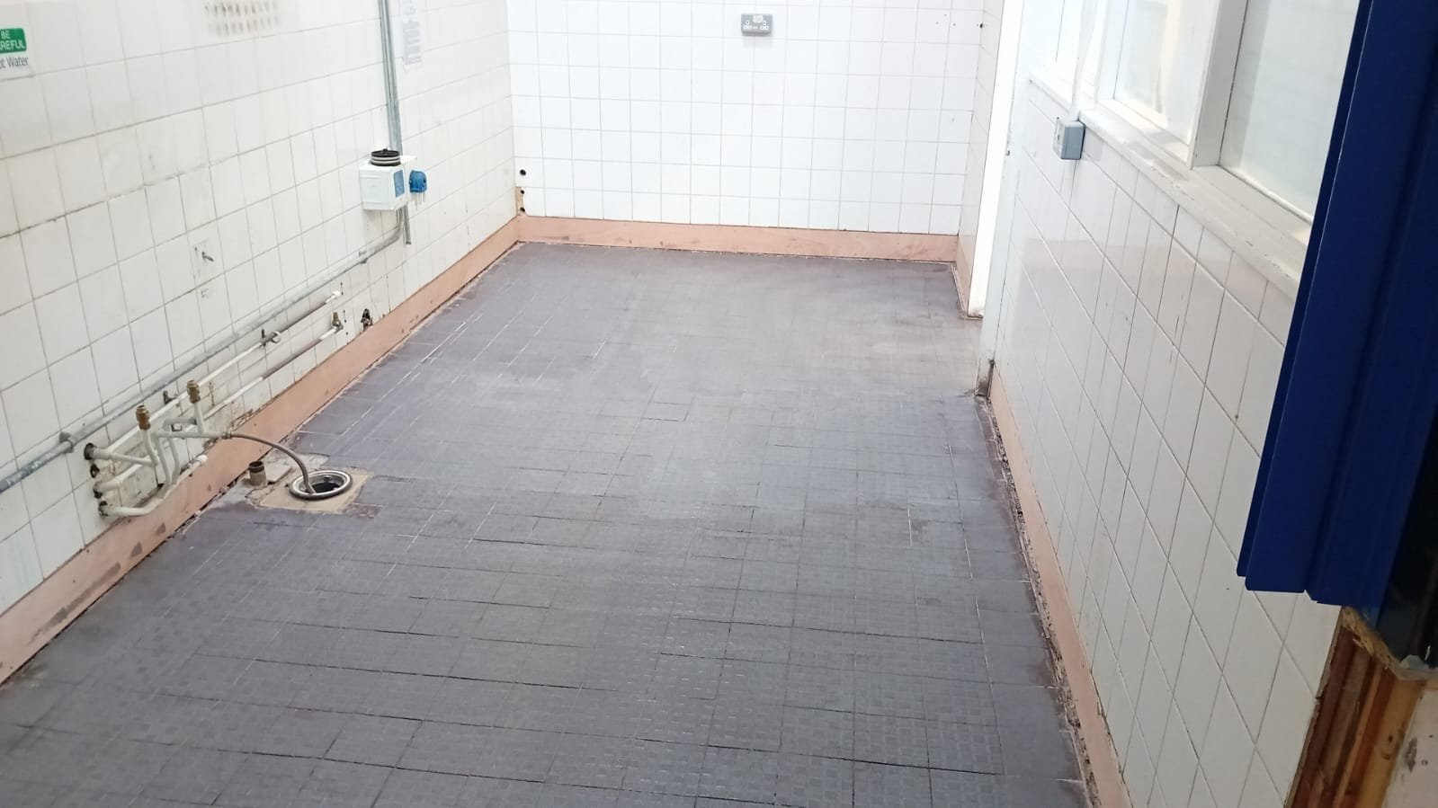 School kitchen stripped out with equipment removed