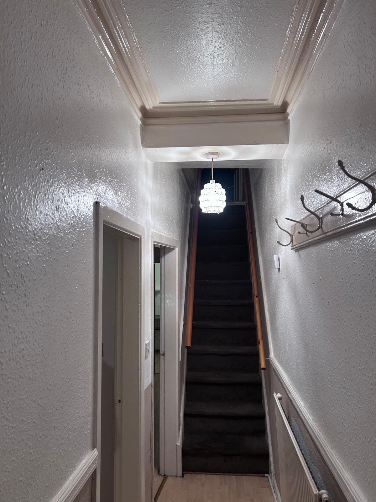 Hallway and staircase with new carpet after refurbishment